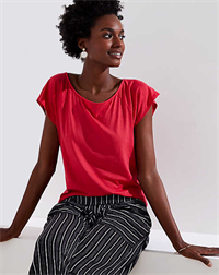 Woman modelling outfit from LOFT