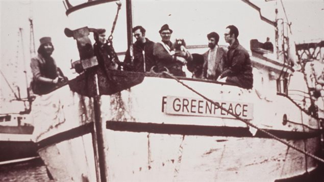 Men on the deck of the 'Greenpeace' fishing trawler