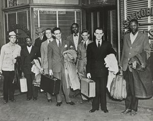 Group of white and black men waiting for bus: "The Journey of Reconciliation"