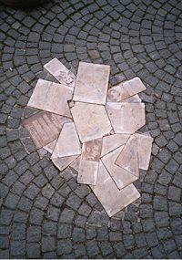 Monument to Hans and Sophie Scholl and the "White Rose", with 'papers' scattered in the paving tiles.